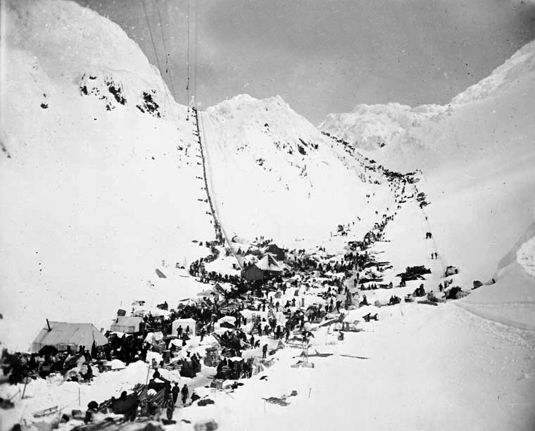 1898 stampeders climbing the Golden Stairs at Chilkoot Pass in gold rush weather, Alaska