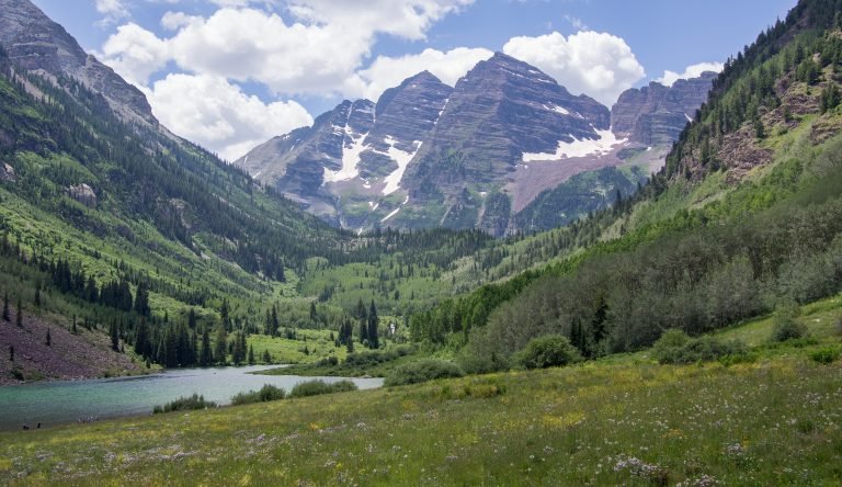 The Maroon Bells rising above the Crater Lake meadow, Four Pass Loop, Colorado